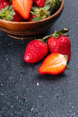 Fresh and Juicy beautiful organic strawberries on wooden background. Top view point.
