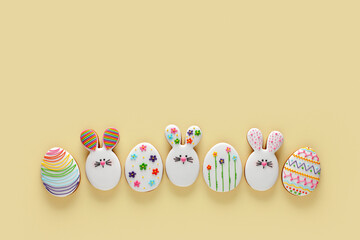 Fototapeta na wymiar Happy Easter. Colorful Easter cookies on the yellow background. 