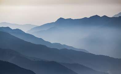 Obraz premium A layered of foggy mountains