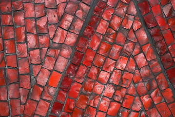 Red background fragment tiles on wall