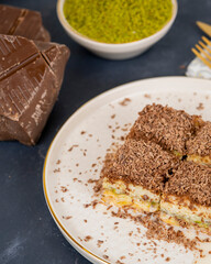 Pistachio baklava on white marble. Traditional middle eastern dessert. Turkish Antep baklava.