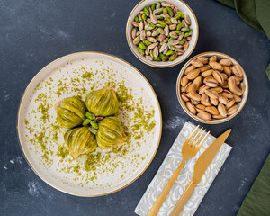 Pistachio baklava on white marble. Traditional middle eastern dessert. Turkish Antep baklava.