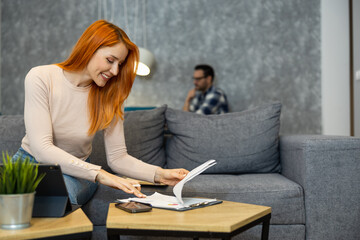 Smiling female freelancer working at home
