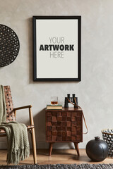 Creative composition of elegant masculine room interior with mock up poster frame, brown armchair, designed commode and personal accessories. Template.