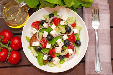 Greek salad with fresh vegetables closeup