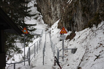 touristic path in mountains with warning signs