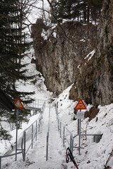 touristic path in mountains with warning signs