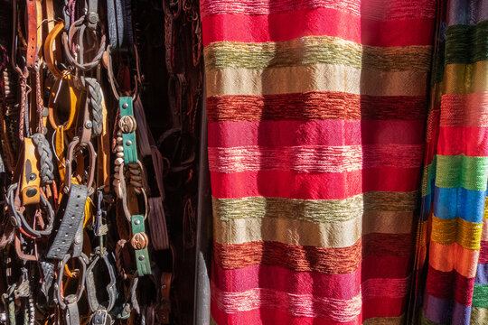 Fabrics and fashion accessories for sale in a souk in Marrakesh