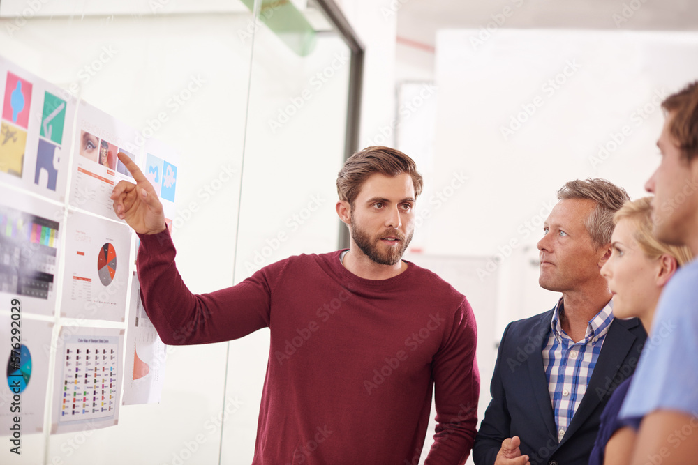 Poster Find a way or make one. Shot of a man presenting data to his colleagues.
