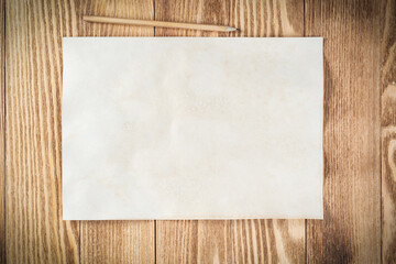 Sheet of paper lying on wooden table