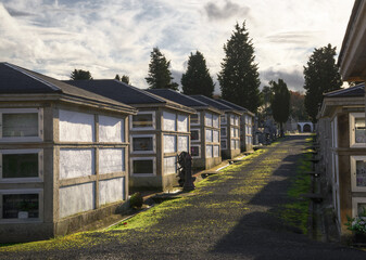 Alleys between community niches and graves with tombstones