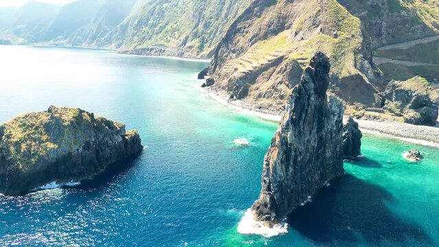 Aerial view of tall lava rocks in ocean, islet towers in Ribeira da Janela, Madeira, Portugal