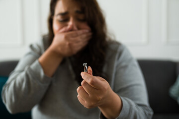 Depressed woman crying breaking up her engagement