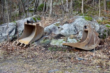 Rusty Digger Shovels in Wooded area near Kristiansand , Norway.