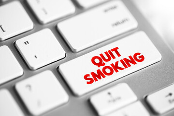 Quit Smoking text button on keyboard, concept background