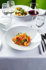 Pasta with shrimps, green asparagus and peppers