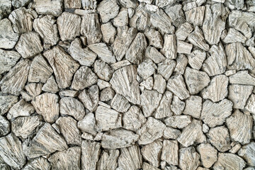 Background wall build from and decorated with seastones, ocean sand and coral remains.