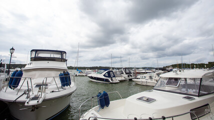 Yachts on sea on the background of cloudy sky