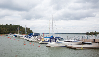 Fototapeta na wymiar Yachts and boats on pier, autumn