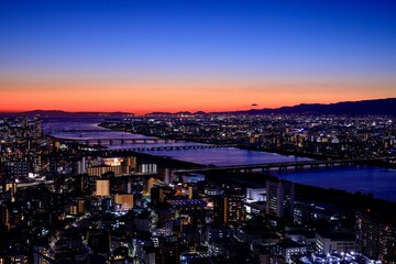 Fototapeta na wymiar 梅田スカイビルから眺める大阪の夕景（大阪湾・明石海峡方面）