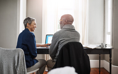Are you glad we put that extra money away. Shot of a senior couple working on their finances at home.