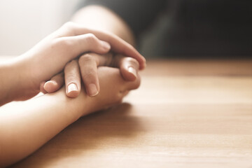 Sometimes its okay to not be okay. Cropped shot of two people holding hands in comfort.