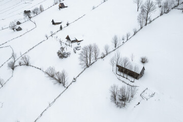 Winter landscape in rural Transylvania. Snowy scene in the Romanian mountains