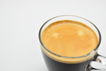hot black coffee put on white table background