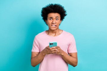 Photo of funny nervous blog owner young guy bite lips forgot password cannot login facebook account...