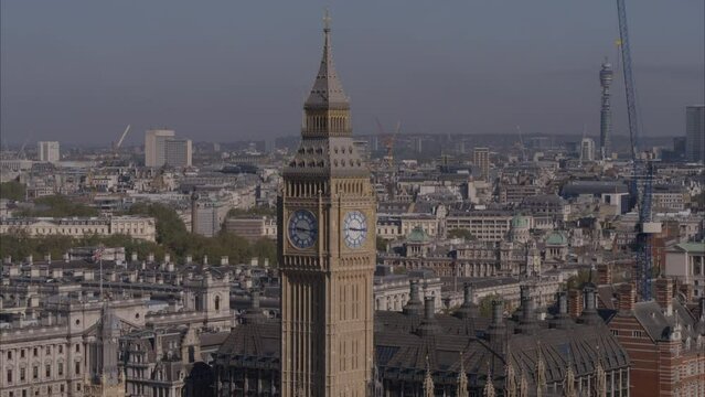 Aerial drone telephoto close up shot of Big Ben with London city in the background