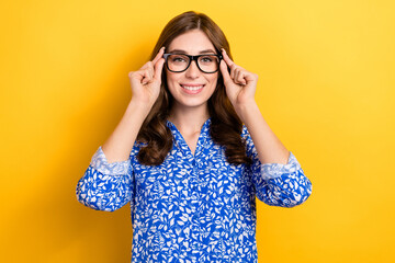 Photo of charming pretty lady wear print shirt arms spectacles smiling isolated yellow color background