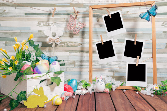 Springtime Memories: Easter eggs and photos on a wooden background and floral decoration