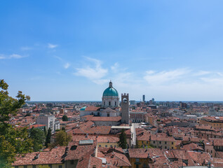 Fototapeta na wymiar Drone view of the old town of Brescia and the central Cathedral of Santa Maria Assunta with a dome and bell tower. Lombardy, Italy