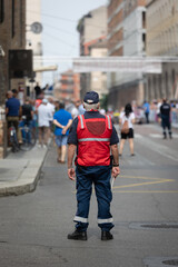 Security and Traffic Control Officer with His Paddle during an Event in a City Street