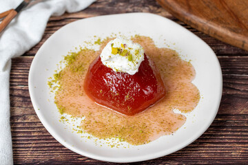 Quince dessert with sorbet on a gray background. Creamy quince dessert. Turkish Ramadan sweet delicacies