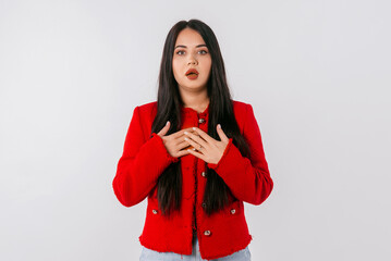 Naklejka premium Oh my God. Amazed young woman in trendy red blazer staring at camera with opened eyes and mouth not believing their eyes what she see. Emotional people