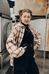 portrait of a young hipster girl in a multi-level parking