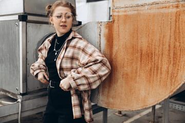 portrait of a young hipster girl in a multi-level parking