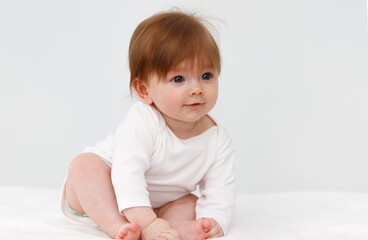 Portrait of cute happy six month baby girl. Childhood and baby care concept