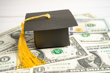 Graduation gap hat on Euro and US dollar banknotes money, Education study fee learning teach concept.