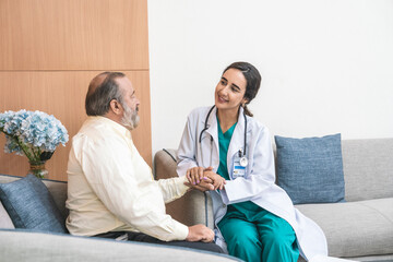 Obraz premium Brazilian female doctor appointment checkup senior caucasian male overweight, blood pressure, diabetes checkup in hospital examination room. Health concept.