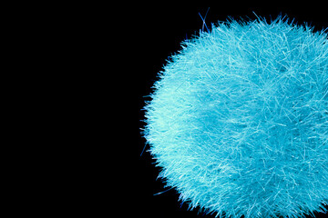 Blue fuzzy sphere and black background.