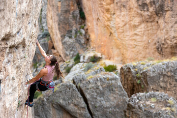 girl rock climber. sport climbing.