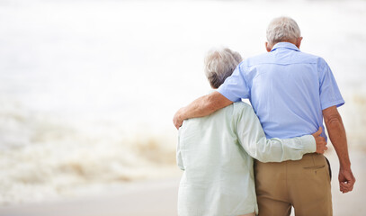 Together forever. Shot of an elderly couple on the beach.