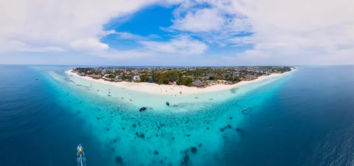 Photo sur Plexiglas Plage de Nungwi, Tanzanie From above, the stunning beauty of Zanzibar's Nungwi Beach is captured in an aerial view with a yacht and palm trees on the sandy beach.