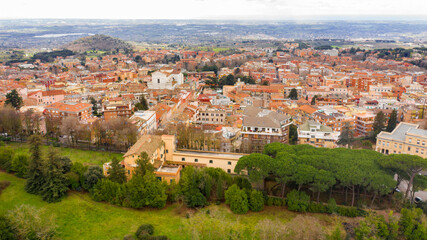 Fototapeta na wymiar Aerial view of Genzano di Roma, a small town located in the Metropolitan City of Rome, Italy. The town is part of the Castelli Romani area.