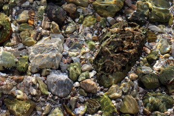 Crystal clear sea water. Rocky beach.