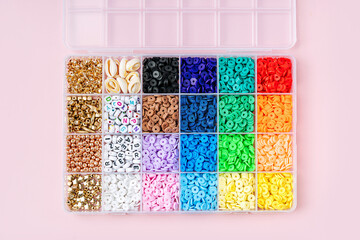 Box with multi-colored beads for children's needlework and crafts.  Handmade and DIY art activity...