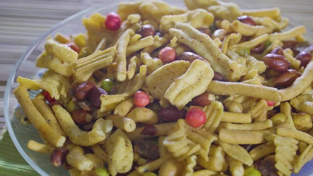 Delicious and Crunchy Mix Nimco in golden antique bowl, Closeup shot of nimko, Traditional refreshment for tea time or evening brunch.