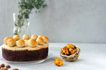 Easter cake simnel for breakfast on a grey background.